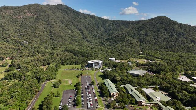 James Cook University Smithfield Campus, Cairns, Queensland, Australia: 4K Aerial Drone Footage of University Campus Surrounded by Tropical Rainforest, Green Hills, Urban Roads, and Natural Landscape