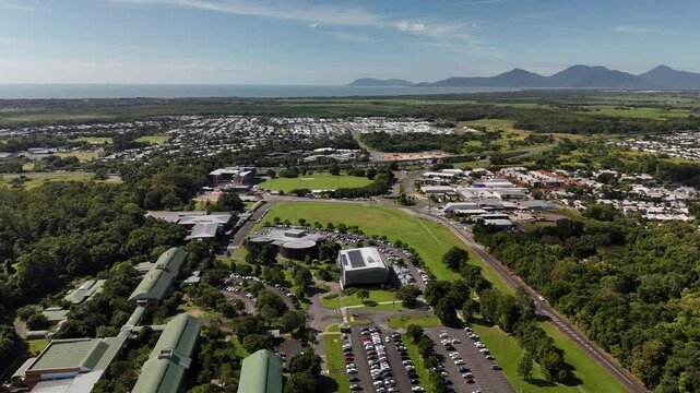 James Cook University Smithfield Campus, Cairns, Queensland, Australia: 4K Aerial Drone Footage of University Campus Surrounded by Tropical Rainforest, Green Hills, Urban Roads, and Natural Landscape