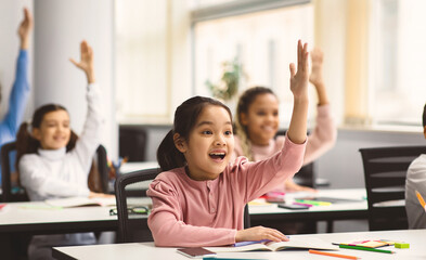 Education, Elementary School, Learning and People Concept. Diverse group of smart junior school...