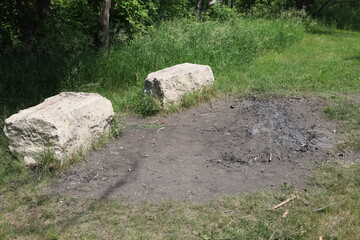 two quarried limestone block benches beside fire pit for Aboriginal Indigenous events ceremonies in...