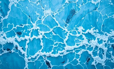 A captivating blue marble texture adorned with the dynamic waves of a sea forms the backdrop of a mesmerizing natural wonder The metamorphic rock composed of calcite with a crystalline surface reveals