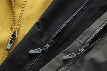 close up of jacket zipper on color background © Claudio