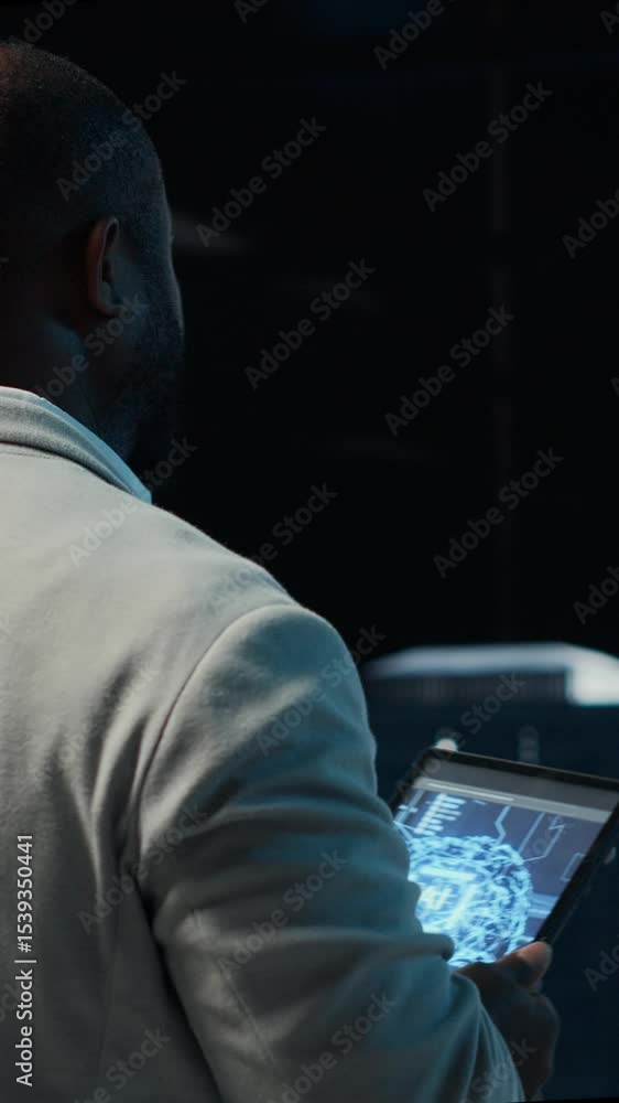 Poster vertical video server room software developer troubleshooting errors using software on laptop. afric