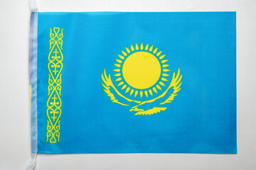 Closeup view of the Kazakhstan national flag isolated over a white background. Concept of government and nationality