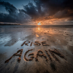 "Rise Again" is written in the sand. A gentle ocean breeze lifts above the written words resting between sea foam and smooth sand.