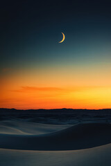 Sunset over desert landscape with crescent moon appearing in evening sky creating spiritual atmosphere for Ramadan celebration and Islamic cultural heritage concept. Muslim cultural symbolism concept.