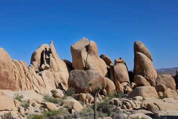 Interesting rock formations and stacks of boulders bake in the desert sun in California's Joshua Tree National Park
