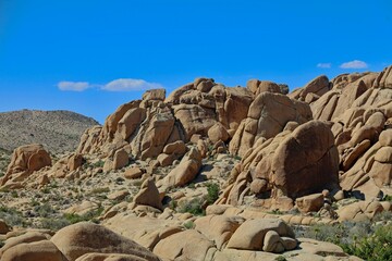 Interesting rock formations and stacks of boulders bake in the desert sun in California's Joshua Tree National Park