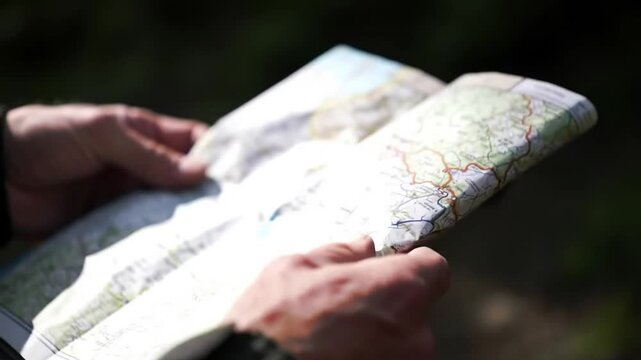 someone is opening a map