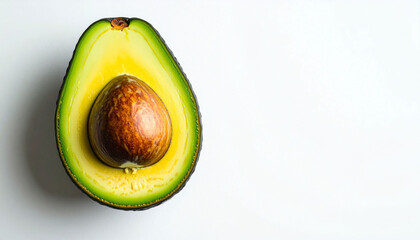 a halved fruit is presented on a plain surface. the outer layer of the fruit is a dark shade of green, transitioning to a vibrant yellow in the inner layers