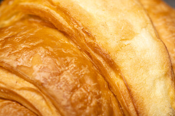 Closeup view of croissant texture. Food background