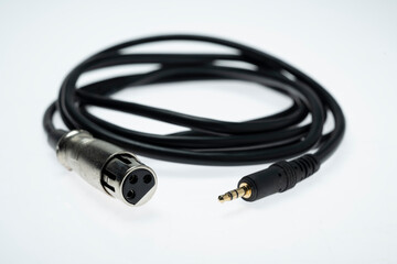 Closeup view of an audio jack cable on a white background. XLR audio cable
