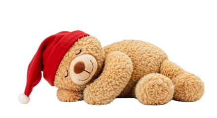 Sleepy teddy bear wearing a red Christmas hat while lying down  