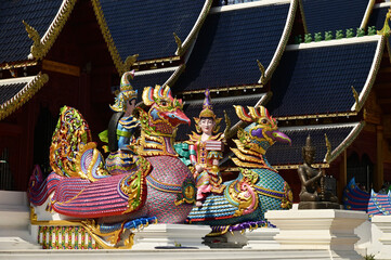 Colorful of Naga statues in Thai art decorate the steps of the ordination hall at Wat Den Sali Si Mueang Kaen temple. Located at Cheng Mai Province in Thailand.