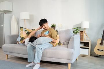 Fototapeta premium Asian young new marriage couple spend leisure time together in kitchen at home. 