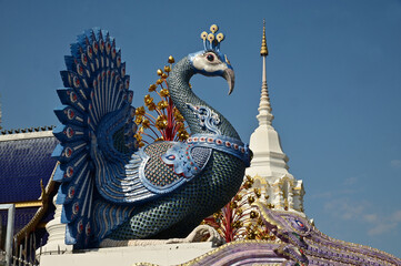 The statues of peacock in Thai literature are Thai art that decorate the front of the pagoda at Wat Den Sali Si Mueang Kaen temple. Located at Cheng Mai Province in Thailand.