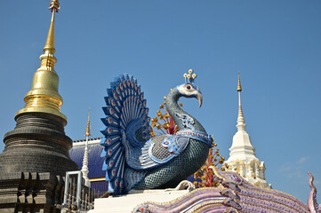 The statues of peacock in Thai literature are Thai art that decorate the front of the pagoda at Wat Den Sali Si Mueang Kaen temple. Located at Cheng Mai Province in Thailand.