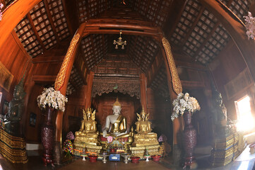 The statue of Phra Chao Tan Jai Buddha is enshrined in a teakwood chapel at Wat Den Sali Si Mueang Kaen temple or Wat Ban Den. Located at Cheng Mai Province in Thailand.