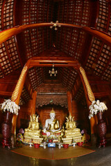 The statue of Phra Chao Tan Jai Buddha is enshrined in a teakwood chapel at Wat Den Sali Si Mueang Kaen temple or Wat Ban Den. Located at Cheng Mai Province in Thailand.