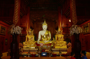 The statue of Phra Chao Tan Jai Buddha is enshrined in a teakwood chapel at Wat Den Sali Si Mueang Kaen temple or Wat Ban Den. Located at Cheng Mai Province in Thailand.