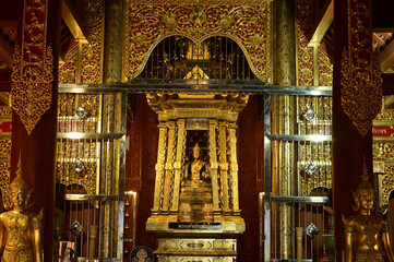 The statue of Phra Chao Pantan Buddha is enshrined in a teakwood chapel at Wat Den Sali Si Mueang Kaen temple or Wat Ban Den. Located at Cheng Mai Province in Thailand.