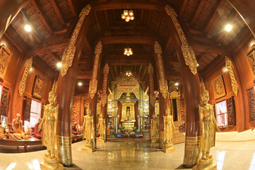 The statue of Phra Chao Pantan Buddha is enshrined in a teakwood chapel at Wat Den Sali Si Mueang Kaen temple or Wat Ban Den. Located at Cheng Mai Province in Thailand.