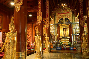 The statue of Phra Chao Pantan Buddha is enshrined in a teakwood chapel at Wat Den Sali Si Mueang Kaen temple or Wat Ban Den. Located at Cheng Mai Province in Thailand.