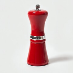 Obraz premium Red pepper grinder with a sleek design against a white isolated background.