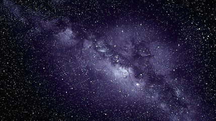 Obraz premium A vast expanse of night sky, filled with countless stars and the Milky Way.