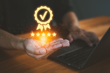 Person holding and showing the best quality assurance with golden five stars, representing high quality service, customer satisfaction, digital excellence, guarantee, standard, and testimonial.