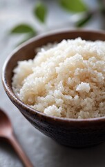 Cooked rice in a brown bowl