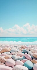 Pastel-hued rocks line a beach, turquoise water meets a vibrant sky