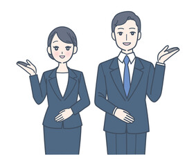 笑顔で案内するスーツ姿の男女