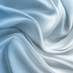 Obraz premium Soft, flowing fabric with a gradient of blue and white, creating a luxurious and elegant texture. The image showcases the smooth, silky drape of the material