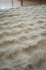 Soft waves of flour displaying rich texture in kitchen