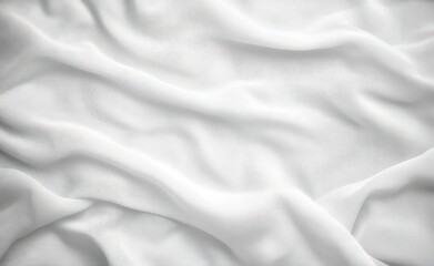 Fototapeta premium Soft white fabric with gentle folds and creases creating a smooth, flowing texture under diffuse light