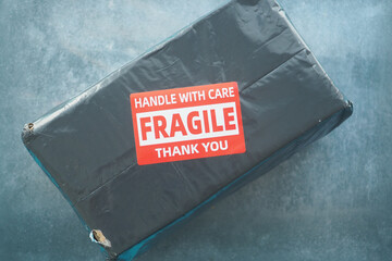 Handling fragile package with care for safe delivery