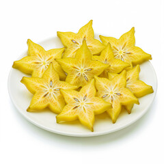 Starfruit slices arranged neatly on white plate exhibit fresh yellow color food photography