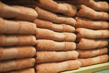 Soft towels neatly stacked in a storage area