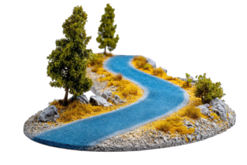 A miniature diorama depicting a meandering stream flowing through a small, rocky landscape with two coniferous trees on the left.  