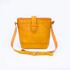 Beautiful yellow leather shoulder bag for women isolated on white background, perfect for leather...