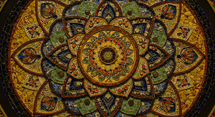 Fototapeta premium Intricate stained glass mandala with vibrant colors, detailed patterns, and floral motifs, showcasing craftsmanship and artistic brilliance in a mesmerizing design