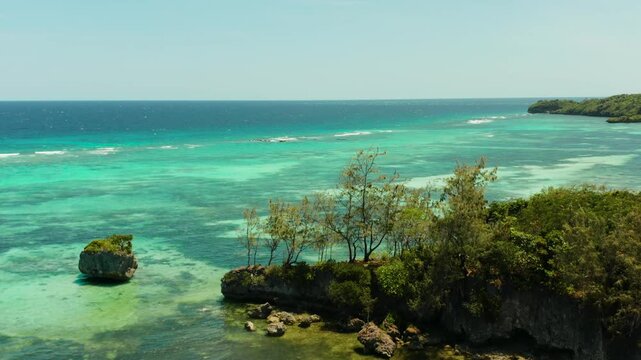 Turquoise lagoon with rocky island and corall reef, aerial view Boracay, Philippines. Summer and travel vacation concept.