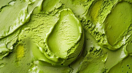 Fototapeta premium Close-up of a scoop of vibrant green matcha ice cream, smooth texture, creamy swirls.