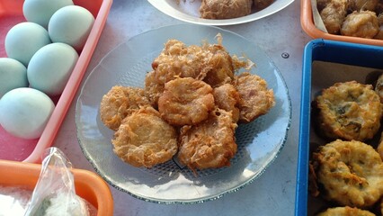 Golden-brown Indonesian-style mashed potato fritters, known as perkedel kentang, made from seasoned mashed potatoes mixed with spices and sometimes minced meat, then deep-fried until crispy outside 