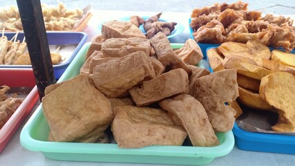 Crispy fried tofu with a golden brown exterior and soft, tender interior. A popular and versatile Indonesian snack or side dish, often served with chili sauce or sweet soy sauce.