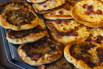 displays a variety of freshly baked Turkish savory flatbreads