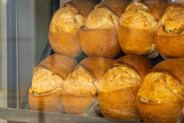 Fresh backed Turkish bread behind the glass on display