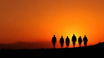 Fototapeta premium Silhouetted Group Walking Toward the Sunrise Symbolizing Hope and New Beginnings in a Tranquil Outdoor Setting