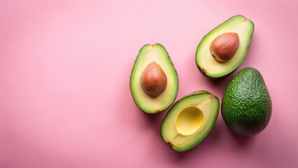 Matures avocado fruit on a soft pink background with subtle texture and gentle lighting